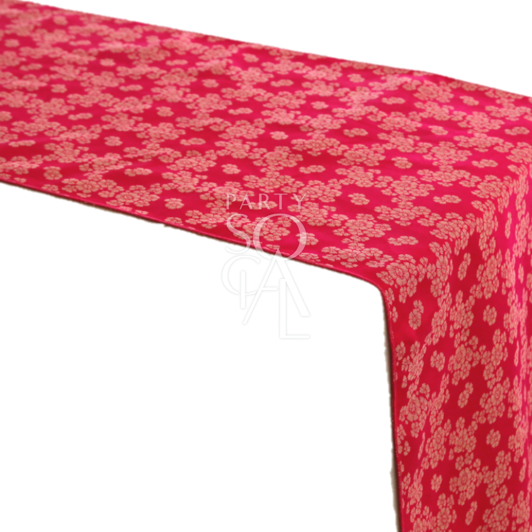 Brocade Table Runner featuring a red fabric with gold floral pattern, ideal for adding elegance to special occasion tabletops.