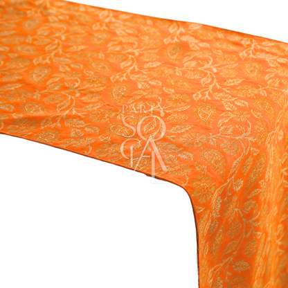 Brocade Table Runner with orange and gold paisley pattern, ideal for elegant event tabletops.