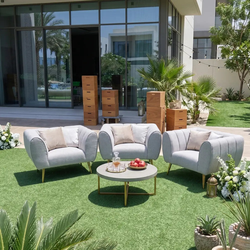 Sand Textured Sofa Single Seater in a chic outdoor lounge setup, ideal for upscale events, featuring sleek design and accompanied by stylish decor elements.