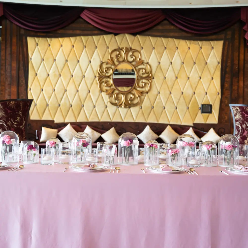 RECTANGULAR TABLECLOTH SATIN elegantly drapes a banquet table, showcasing its luxurious sheen amid gold accents and floral arrangements, ideal for upscale events.