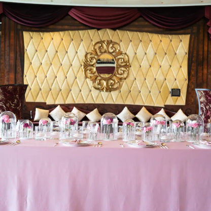 RECTANGULAR TABLECLOTH SATIN elegantly drapes a banquet table, showcasing its luxurious sheen amid gold accents and floral arrangements, ideal for upscale events.