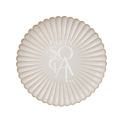 SCALLOPED LIKE PLATES: Ivory-cream round charger with scalloped edges and gold trim, featuring fluted texture and central PARTY SOCIAL text, ideal for elegant event dining.