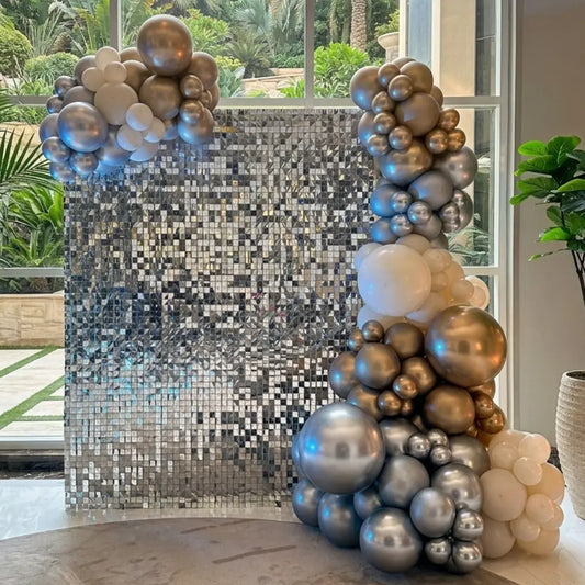 Golden Shimmer Celebration Wall adorned with mirrored tiles and balloon arrangement, ideal for chic events. Perfect backdrop for weddings and parties.