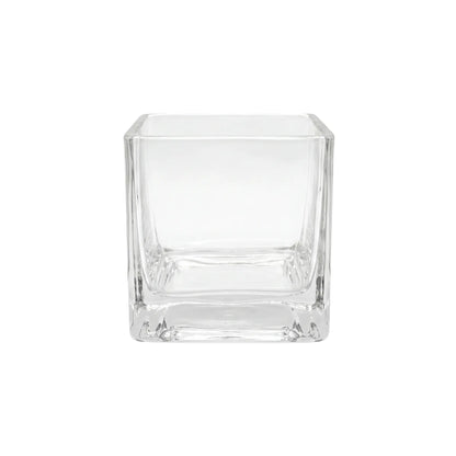 SQUARE TEA LIGHT CANDLE HOLDER: A clear glass cube ideal for enhancing event decor, adding elegance and warm ambiance to special occasions. Candles sold separately.