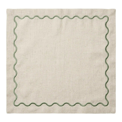 A square beige linen napkin with a scalloped green border, shown flat against a white background.
