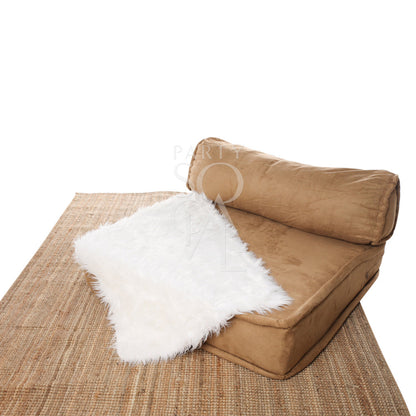 Sheepskin Rectangular draped on a brown couch, ideal for decor or event props, enhancing any setting with its plush texture.