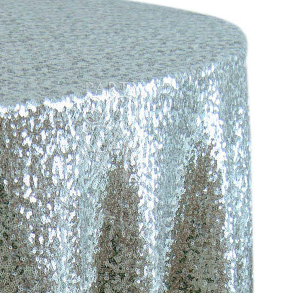 Close-up of a ROUND TABLECLOTH SEQUIN, showcasing its intricate silver sequined fabric, ideal for enhancing the elegance of special occasions.