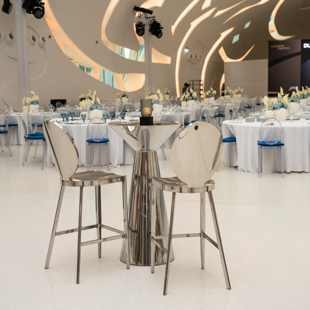 BAR STOOL SILVER with mirrored design, elegantly styled for event settings, available from Party Social. Ideal for enhancing any special occasion&