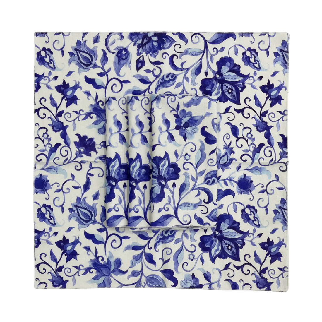 Azure Garden Floral Napkin on a matching blue-and-white floral tablecloth, showcasing elegant botanical patterns, perfect for enhancing sophisticated table settings at Party Social events.