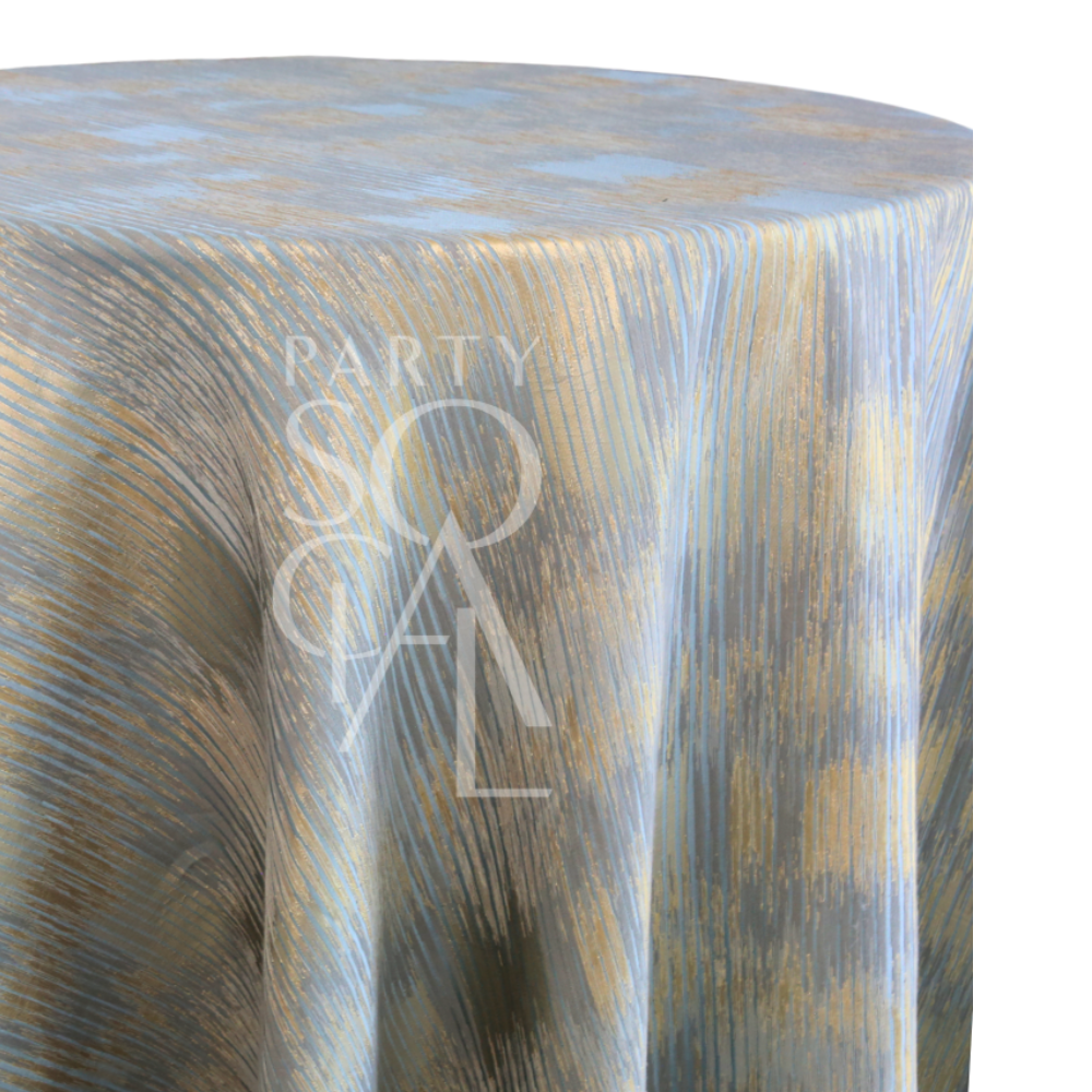 CELESTIAL HORIZON TABLECLOTH features abstract gold and blue brushstrokes on a round table, perfect for creating an ethereal atmosphere at special events.