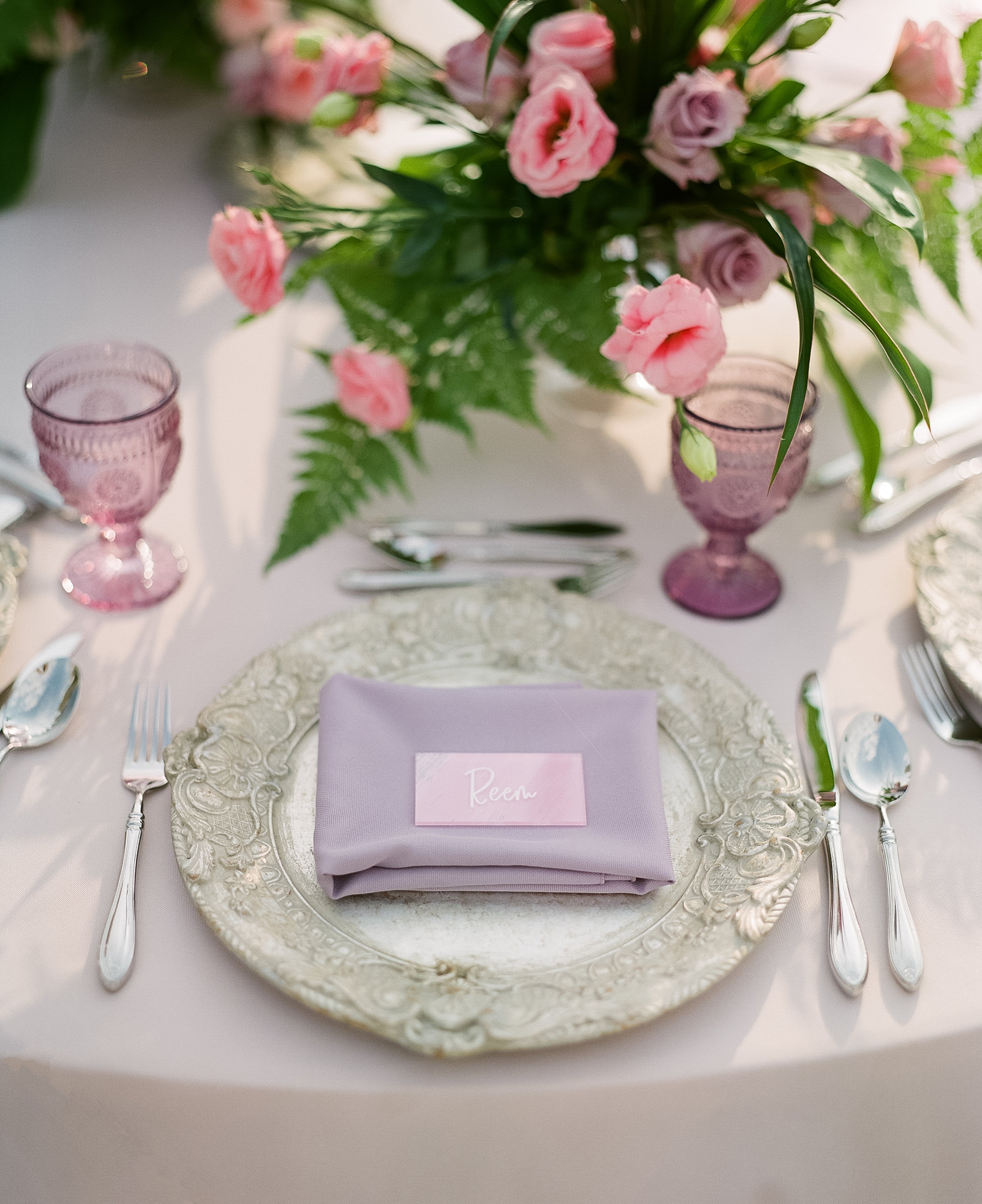 Charger Plate - Florentine Antique Wood on an elegant table setting with silverware and pink floral centerpiece, exemplifying luxurious event decor.