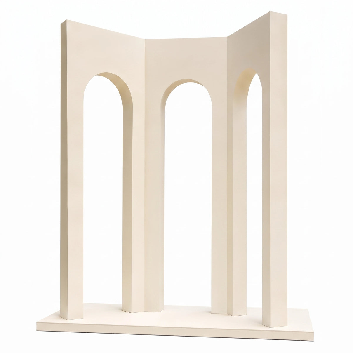 A minimalist cream-colored decorative sculpture featuring three vertical columns framing arched openings, standing on a rectangular base against a solid white background.