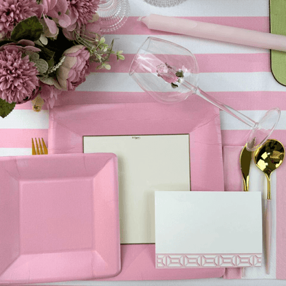 Alt text: Grosgrain Square Paper Salad &amp; Dessert Plates in Light Pink - 8 Per Package, elegantly set on a pink and white table with floral accents.