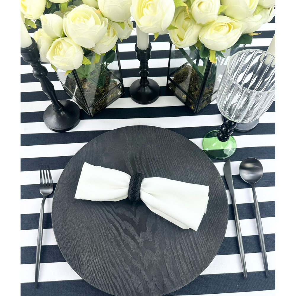 Alt text: Simple Plastic Wooden-Like Charger Plate set on a table with white napkin and flowers, showcasing elegant event tableware from Party Social.