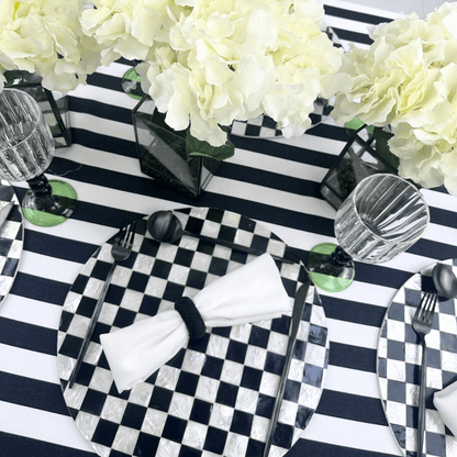 Black &amp; White Linen Tablecloth on a set dining table with white flowers and glassware.