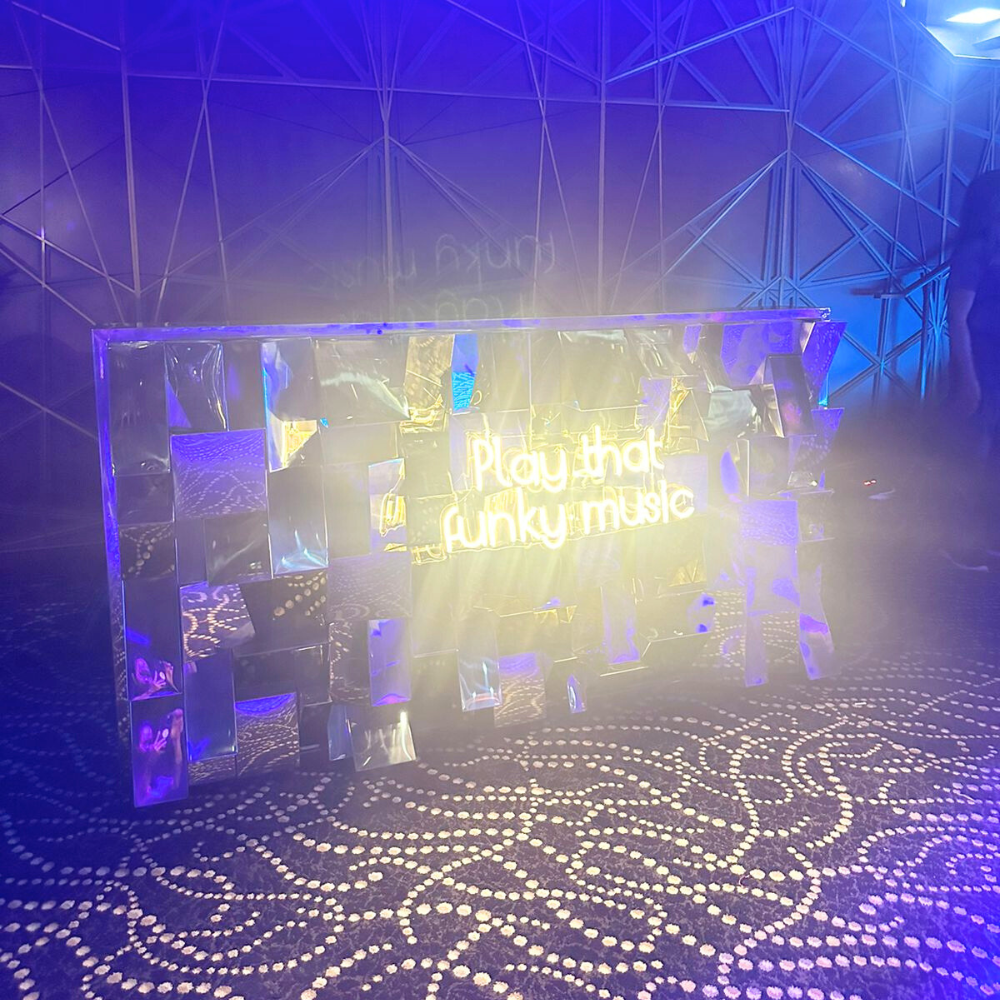 Play That Funky Music- LED Neon Sign displayed on a mirror wall, ideal for enhancing party atmospheres with its vibrant glow, requiring electric connection.