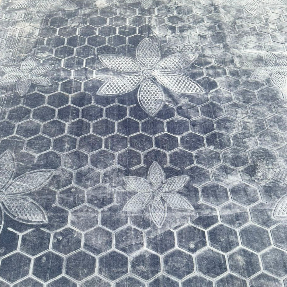 RUG BLUE SELF PRINT with a grey and white floral pattern, ideal for enhancing event settings, shown in close-up detail.