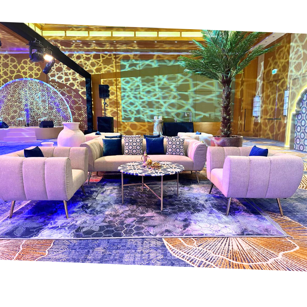 Blue Self Print Rug on a living room floor, complementing the furniture setup, ideal for enhancing event settings with elegance.