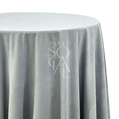 Round Tablecloth Velvet, elegantly draped over a round table, ideal for enhancing special occasions with a touch of luxurious texture and style.