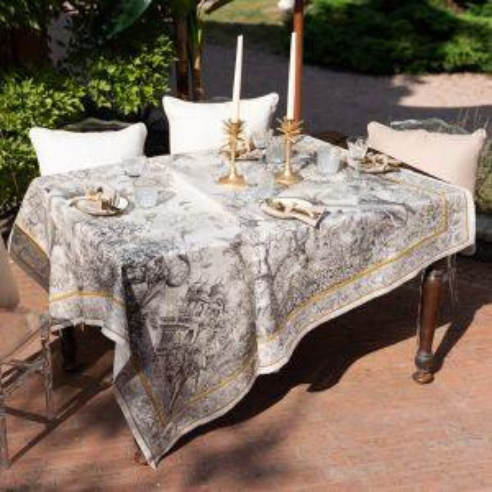 Tantra Pure Linen Tablecloth displayed on a table set with candles, enhancing the elegance of a dining setup.