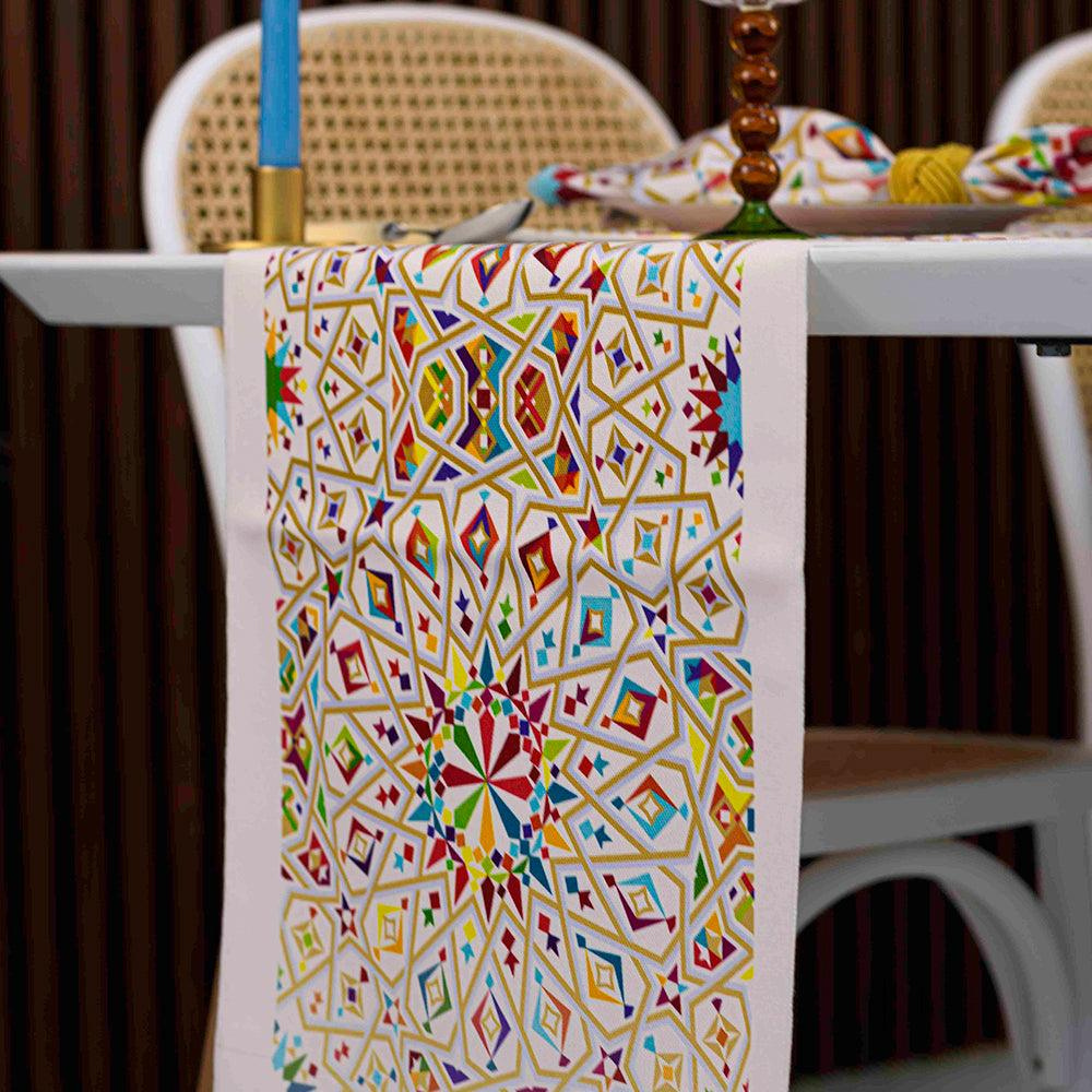 Arabesque Polyester Linen Runner on a table with intricate, colorful patterns, enhancing the elegance of special table setups.