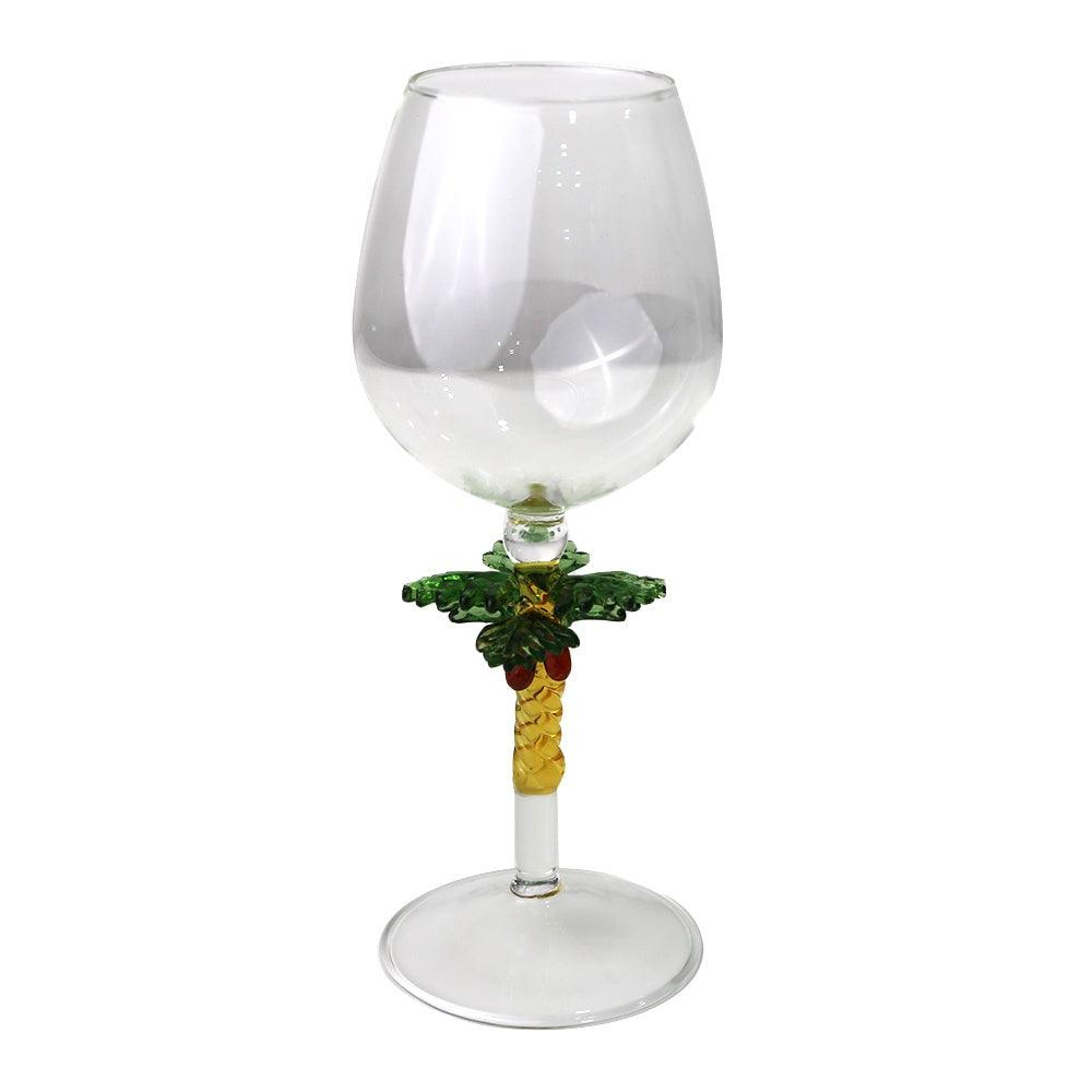 Palm Stemmed Glass-4 per box: A glass with a gold palm tree stem, ideal for themed events and adding elegance to dinner parties.