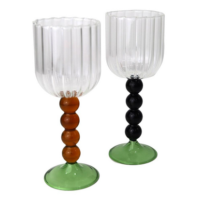 Four Ball Stemmed Glass-4 per box: Two glasses featuring black and green decorative balls, ideal for adding elegance and color to any event or dinner party.