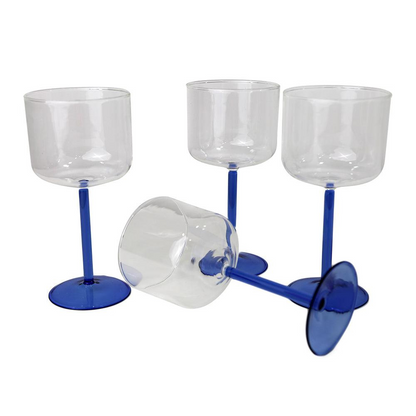 Color Stemmed Glass- 4 per box, showcasing elegant, clear wine glasses with distinct blue stems, perfect for enhancing any event or dinner party.