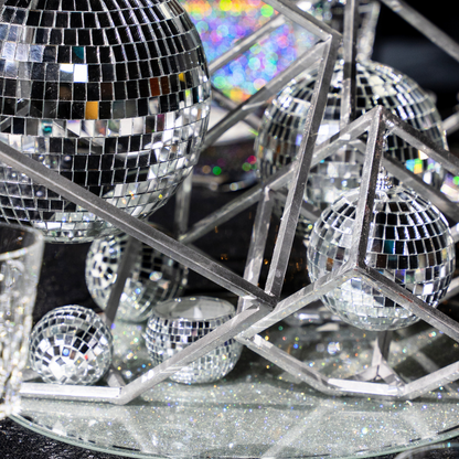 Disco Ball Candle Holder on a stand, featuring reflective surfaces with small square mirrors, ideal for premium events. Perfect addition to Party Social&