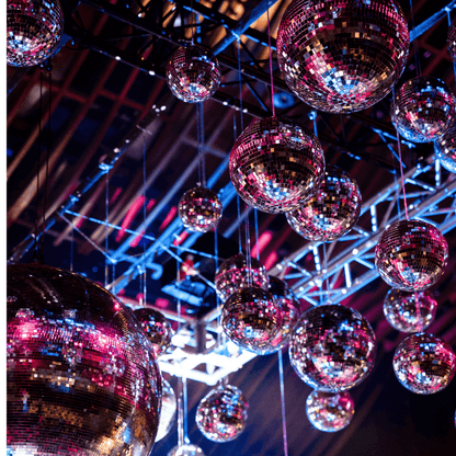 Disco Balls hanging from a ceiling, perfect for adding a stylish touch to events.