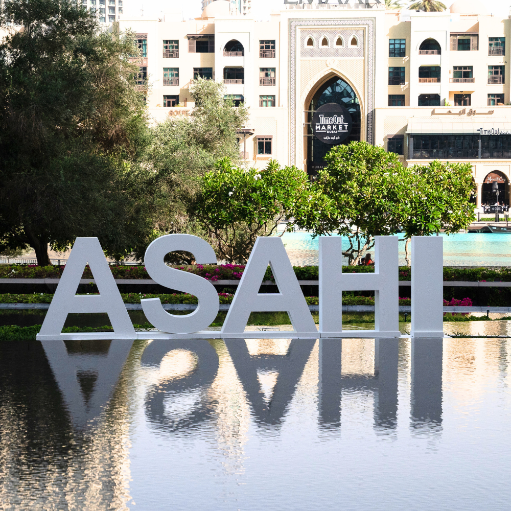 Standing Wood Letter displayed outdoors, reflecting in water, ideal for weddings or events, perfect for enhancing entrances with elegance and style.