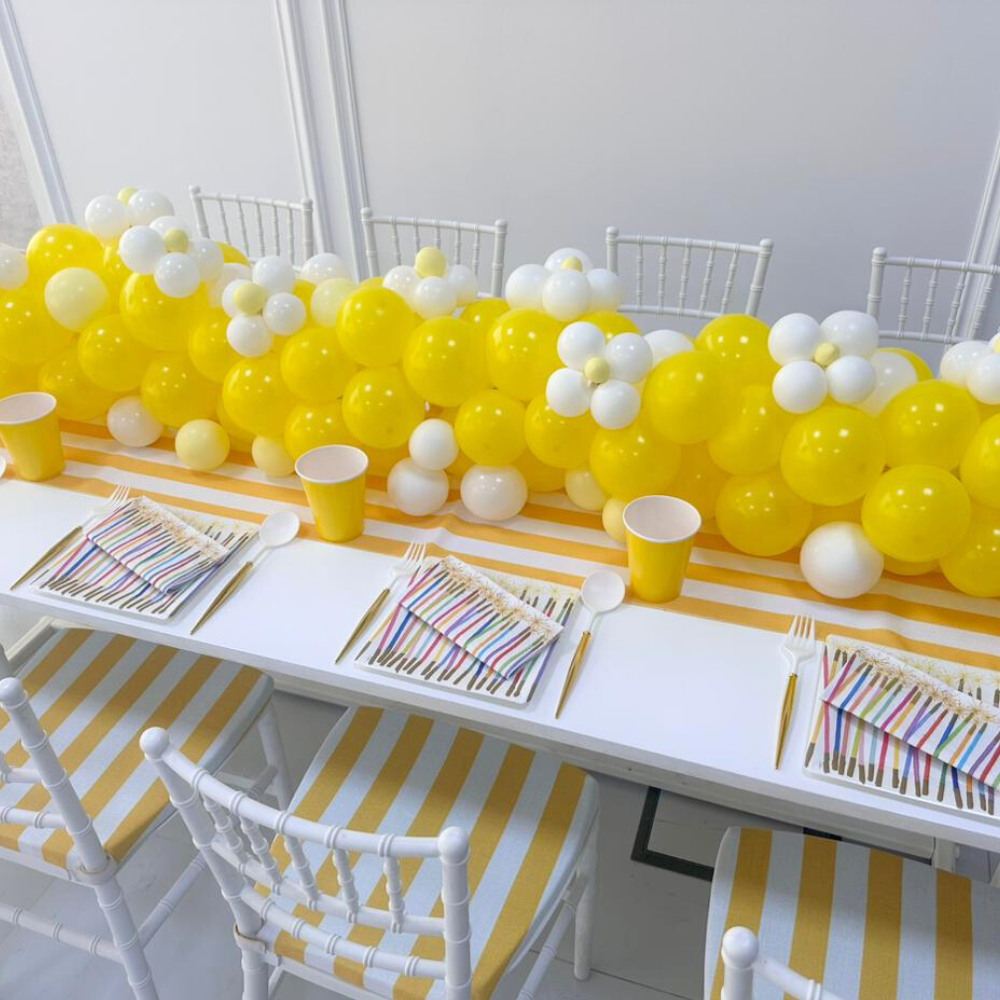 MINI CHIAVARI CHAIR WHITE on a table with yellow and white balloons, ideal for children&