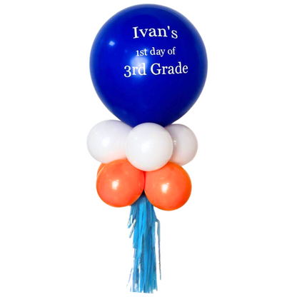 Personalised Back to School Balloon Wand featuring a blue balloon with white custom text, ideal as a photo prop for memorable school moments.