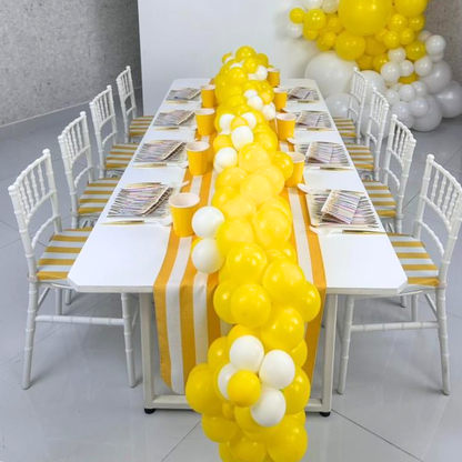 Mini Chiavari Chair with Yellow Stripes Cushion displayed beside a table with balloons, ideal for children&