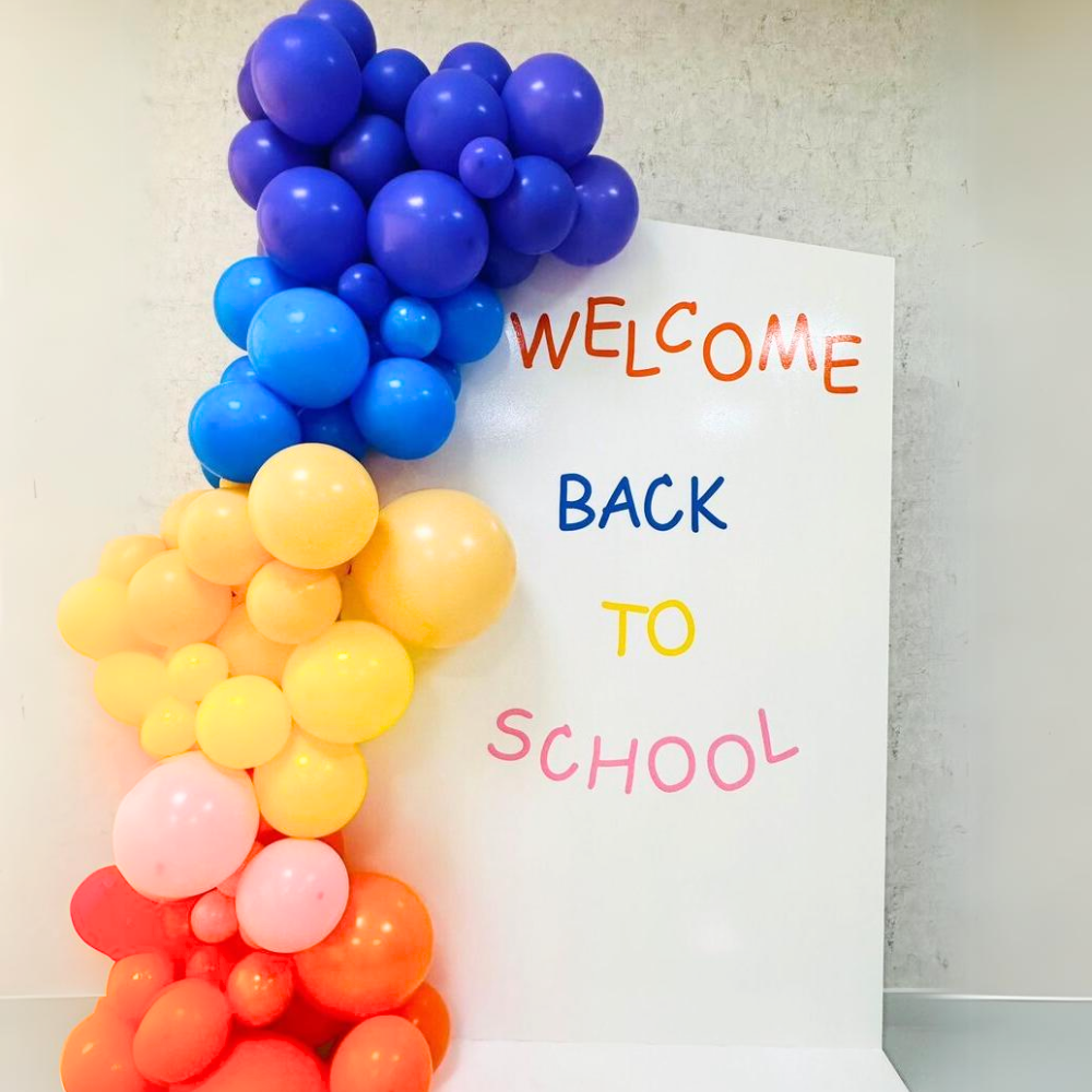 Angled Wall Balloon Backdrop featuring clustered balloons, ideal for enhancing party atmospheres at events like birthdays and showers. Customizable colors available.