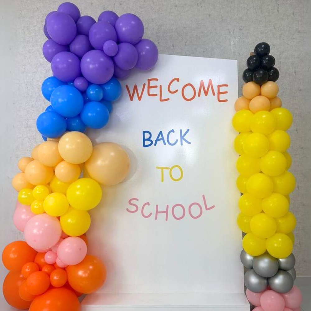 Angled Wall with Pencil Pillar Balloon Backdrop for Back to School events, featuring customizable balloon colors. Perfect for enhancing party decor from Party Social.