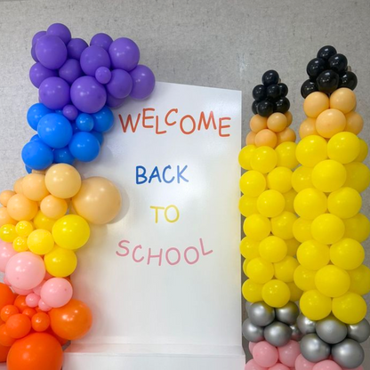 Angled Wall with Pencil Pillar Set Balloon Backdrop for back-to-school events, featuring a creative balloon display by Party Social.