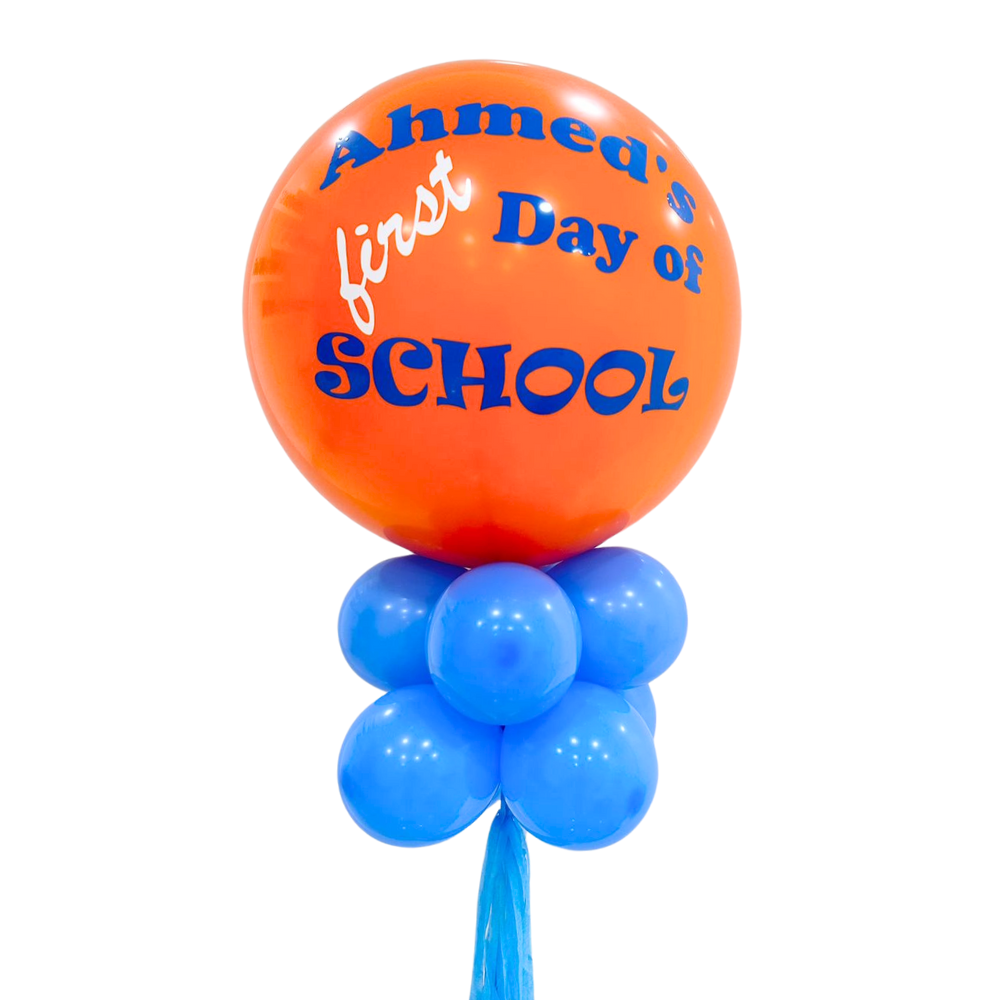 Personalised Back to School Balloon Wand featuring an 18-inch balloon with custom writing, surrounded by smaller coordinating balloons, perfect for memorable first day of school photos.