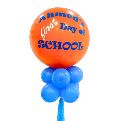 Personalised Back to School Balloon Wand featuring an 18-inch balloon with custom writing, surrounded by smaller coordinating balloons, perfect for memorable first day of school photos.