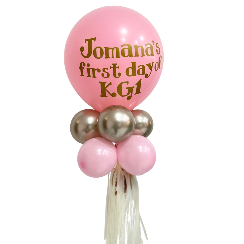 Personalised Back to School Balloon Wand featuring a pink balloon with gold text, held by a white string, ideal for capturing memorable first-day-of-school photos.