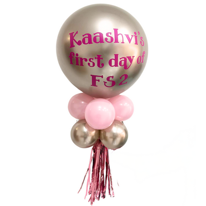 Personalised Back to School Balloon Wand - Metallic features a large balloon with pink writing, smaller coordinating balloons, and a matching tassel, perfect for memorable photos.