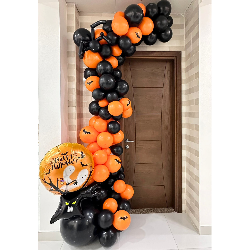 Ghost Tree Balloon Garland featuring black and orange balloons with ghost and bat prints, arranged on a door, perfect for Halloween parties.