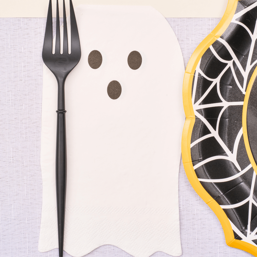 Boo Treats Ghost Guest Towel Napkins, featuring a ghost face design, perfect for Halloween gatherings. Set includes 16 napkins, enhancing festive table settings.