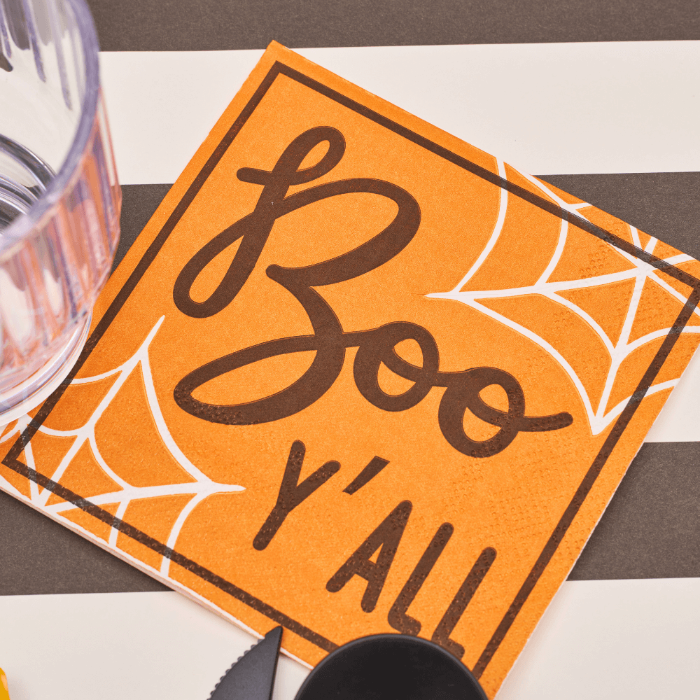 Boo Treats Cocktail Napkins with playful Halloween design featuring spider webs, perfect for enhancing your spooky table setting.