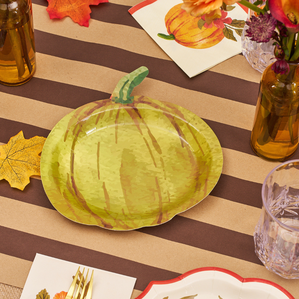 Autumn Foliage Pumpkin Salad Plate on a table, featuring a painted pumpkin design, paired with flowers and glassware, ideal for creating charming party tablescapes.