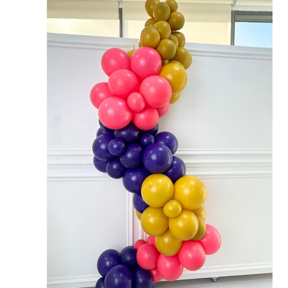 Customize Inflated Balloon Garland-3.5m displayed against a white wall, showcasing its vibrant design and ease of hanging for party decoration.