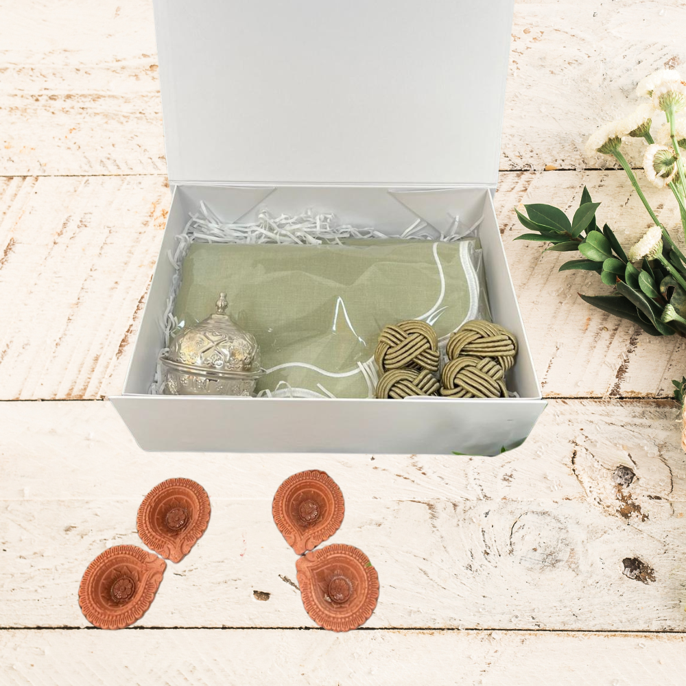 Diwali Thali Gift Box-Medium featuring a silver Moroccan mini-bowl, scalloped placemats, napkins, and cotton knot napkin rings inside a sturdy gift box.