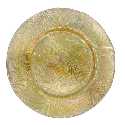 CHARGER PLATE - GOLD SWIRL: A large, round glass plate with an iridescent gold-green swirl pattern and undulating edge, perfect for elegant dining settings.