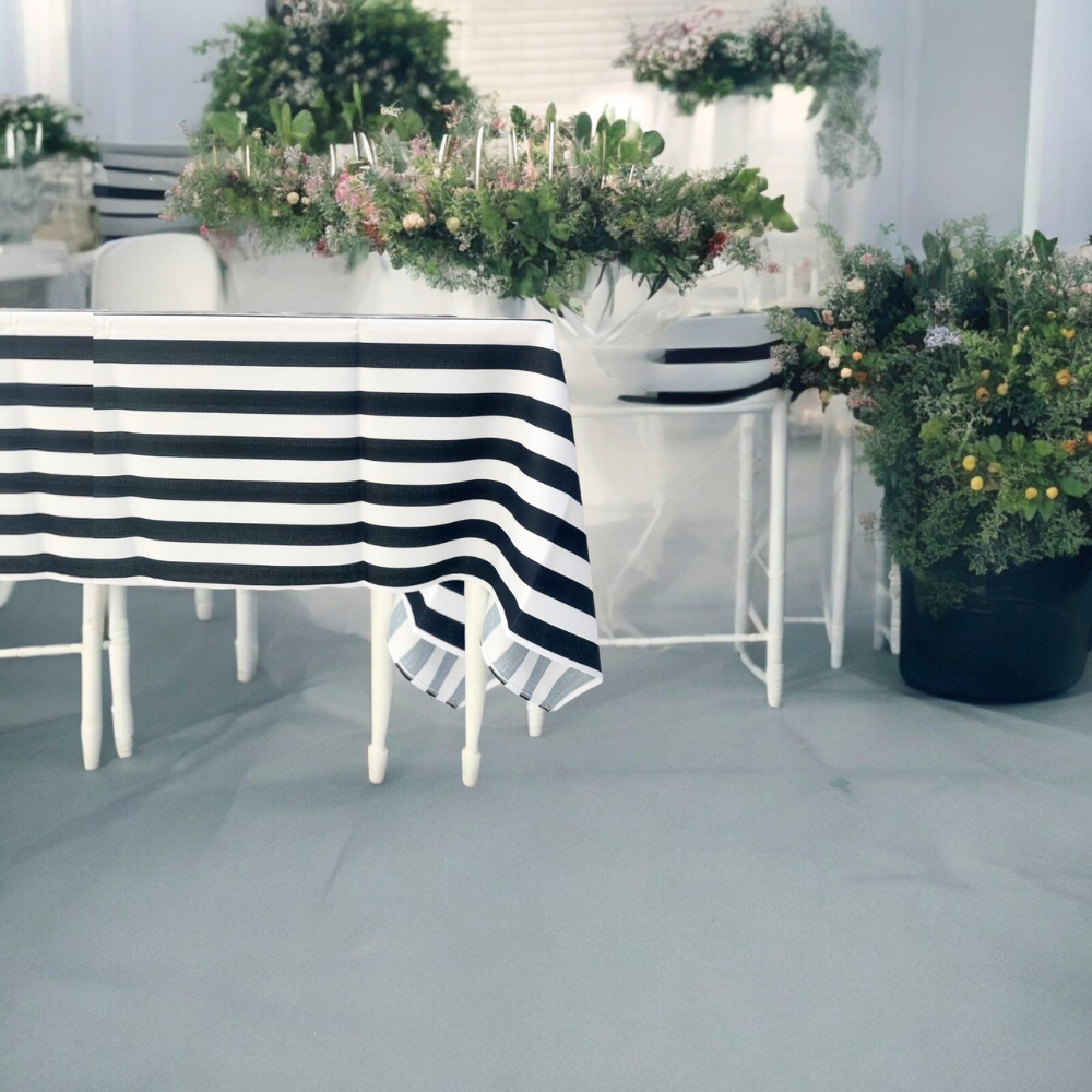 A Black &amp; White Linen Tablecloth from Party Social, enhancing your table setting with a premium striped design. Perfect for events, this reusable tablecloth elevates your dining experience effortlessly.