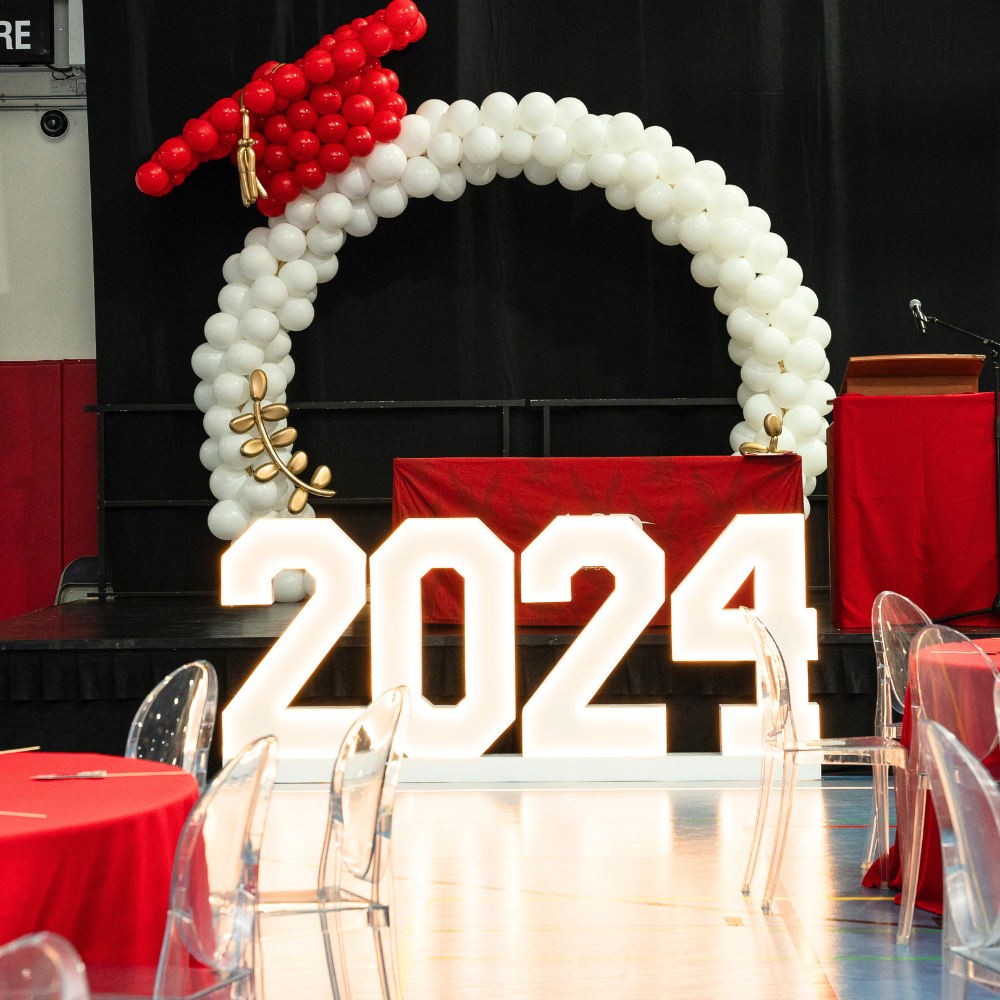 LED Stand- 2024 at a graduation party setup, showcasing illuminated numbers as part of event decor. Rentable per number, ideal for celebrations.